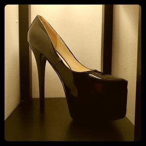 Black platform heels, still new with the box.